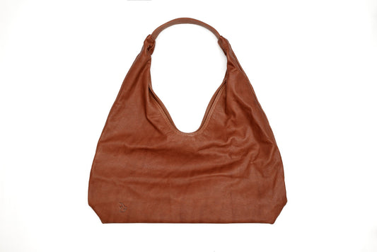Brown leather handbag on a white background